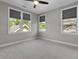 Bedroom with plush carpet, three bright windows, and a modern ceiling fan at 5554 Colonial Chatsworth Cir, North Charleston, SC 29418