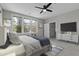 Beautifully staged bedroom with natural light and ceiling fan at 5554 Colonial Chatsworth Cir, North Charleston, SC 29418