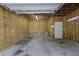 Unfinished garage with concrete floor at 5554 Colonial Chatsworth Cir, North Charleston, SC 29418