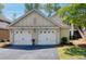 Two car garage with white doors at 5554 Colonial Chatsworth Cir, North Charleston, SC 29418