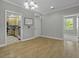 Open-concept layout with hardwood floors, perfect for entertaining at 5554 Colonial Chatsworth Cir, North Charleston, SC 29418