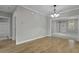 Spacious living room with hardwood flooring and neutral color scheme at 5554 Colonial Chatsworth Cir, North Charleston, SC 29418