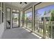 Spacious screened-in porch with views of the neighborhood at 5554 Colonial Chatsworth Cir, North Charleston, SC 29418