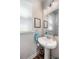 Bright half bathroom featuring a pedestal sink, decorative towel, and beach-themed accents at 571 Mclernon, Johns Island, SC 29455