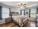 Comfortable bedroom with neutral tones, ceiling fan and large windows at 571 Mclernon, Johns Island, SC 29455