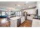 Spacious kitchen with stainless appliances, a center island, and open layout to the living area at 571 Mclernon, Johns Island, SC 29455