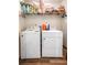 Bright laundry room features a Whirlpool washer and dryer and shelving for ample storage at 571 Mclernon, Johns Island, SC 29455