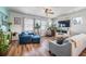 Inviting living room with hardwood floors, comfortable seating, and beach-themed decor at 571 Mclernon, Johns Island, SC 29455