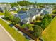 Aerial view of a home with solar panels, fenced in yard, and landscaping at 7601 Stargazer Dr, Hanahan, SC 29410