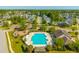 Aerial view of sparkling community pool, clubhouse, and recreation area surrounded by homes and lush landscaping at 7601 Stargazer Dr, Hanahan, SC 29410