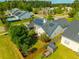 Charming home aerial view with solar panels, fenced in yard, and community pool at 7601 Stargazer Dr, Hanahan, SC 29410