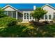 Charming backyard with well-maintained lawn, pergola, solar panels and beautiful landscaping for outdoor enjoyment at 7601 Stargazer Dr, Hanahan, SC 29410