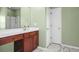 Bathroom featuring green walls, a marble-look tile floor, and vanity at 7601 Stargazer Dr, Hanahan, SC 29410