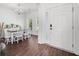 Dining room with modern chandelier, hardwood flooring, and elegant furnishings at 7601 Stargazer Dr, Hanahan, SC 29410