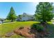 Desirable home with lush lawn and landscaping; features a two-car garage under a bright blue sky at 7601 Stargazer Dr, Hanahan, SC 29410