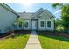 Charming home with well-manicured front yard, inviting pathway, and classic curb appeal at 7601 Stargazer Dr, Hanahan, SC 29410