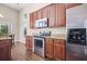 Modern kitchen featuring stainless steel appliances, dark cabinets, and bright natural light at 7601 Stargazer Dr, Hanahan, SC 29410