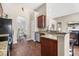 Open kitchen with stainless appliances, granite countertops, and view into dining and living areas at 7601 Stargazer Dr, Hanahan, SC 29410