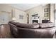 Spacious living room with leather sectional, fireplace, and open floor plan at 7601 Stargazer Dr, Hanahan, SC 29410