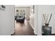 Inviting living room featuring soaring windows and sleek hardwood flooring at 7601 Stargazer Dr, Hanahan, SC 29410