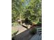 Backyard wooden deck area with pond and bench seating surrounded by a lush green, serene landscape at 815 W Carolina Rd, McClellanville, SC 29458