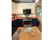 Modern kitchen with two-tone cabinets, stainless steel appliances, and butcher block countertops at 815 W Carolina Rd, McClellanville, SC 29458