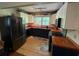 Well-lit kitchen featuring two-tone cabinets, butcher block countertops, and stainless steel appliances at 815 W Carolina Rd, McClellanville, SC 29458