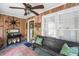 Charming enclosed porch with wooden ceiling, large bench, and decorative vintage accents at 815 W Carolina Rd, McClellanville, SC 29458
