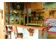 A rustic bar area featuring a wood countertop, stools, beach-themed decor, and fun, quirky accents at 816 Savage Rd, Charleston, SC 29414