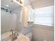 Updated bathroom with white vanity, window, and shower/tub combo behind shower curtain at 816 Savage Rd, Charleston, SC 29414