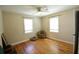 Bright bedroom features hardwood flooring, two windows and neutral walls and decor at 816 Savage Rd, Charleston, SC 29414