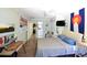 Cozy bedroom with wood-look flooring, ceiling fan, and unique wall art and decor at 816 Savage Rd, Charleston, SC 29414