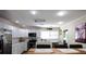 Bright kitchen with white cabinets, modern appliances, and a dining area perfect for Gathering meals at 816 Savage Rd, Charleston, SC 29414