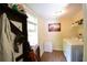 Convenient laundry room with washer, dryer, window, and storage rack at 816 Savage Rd, Charleston, SC 29414