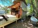 Inviting outdoor bar and deck area, perfect for entertaining guests with a surfboard and picnic table at 816 Savage Rd, Charleston, SC 29414