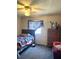 Cozy bedroom featuring a comfortable bed, dresser, ceiling fan and natural light at 8330 Longridge Rd, North Charleston, SC 29418