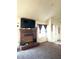 Cozy living room featuring a brick fireplace, large window and neutral carpet at 8330 Longridge Rd, North Charleston, SC 29418