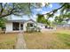 A charming backyard with a patio, lush greenery, and stylish home, perfect for outdoor relaxation and entertaining at 847 Condon Dr, James Island, SC 29412
