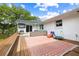 A backyard with a patio, a slide, and a trampoline provides an outdoor fun area for recreation and leisure at 847 Condon Dr, James Island, SC 29412