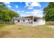 Expansive backyard features a covered patio and large grassy area, perfect for outdoor enjoyment at 847 Condon Dr, James Island, SC 29412