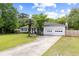 Charming home with a two-car garage and a long driveway, surrounded by lush green lawn at 847 Condon Dr, James Island, SC 29412