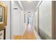 Well-lit hallway with hardwood floors and art-adorned walls creates an inviting atmosphere at 847 Condon Dr, James Island, SC 29412