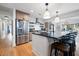Modern kitchen featuring stainless steel appliances, a large island with seating, and hardwood floors at 847 Condon Dr, James Island, SC 29412