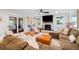 Comfortable living room features a fireplace, ceiling fan, and sliding glass doors at 847 Condon Dr, James Island, SC 29412