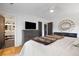 This main bedroom has hardwood floors, ceiling fan, closet, and decorative accents at 847 Condon Dr, James Island, SC 29412