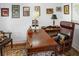 An office with hardwood desk, leather chair, and wall art creates a professional, classic workspace at 847 Condon Dr, James Island, SC 29412
