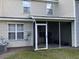 View of a screened in porch with patio furniture and nice backyard at 8634 Grassy Oak Trl, North Charleston, SC 29420