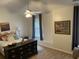 Comfortable bedroom with ceiling fan, and dresser with gold pulls at 8634 Grassy Oak Trl, North Charleston, SC 29420