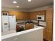Functional kitchen with wood cabinets and stainless-steel appliances at 8634 Grassy Oak Trl, North Charleston, SC 29420