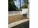 Backyard with white fence and AC unit, offering private outdoor space at 9032 Maple Grove Dr, Summerville, SC 29485